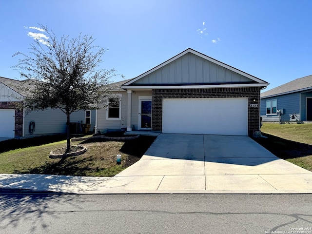 ranch-style home with brick siding, board and batten siding, concrete driveway, and an attached garage