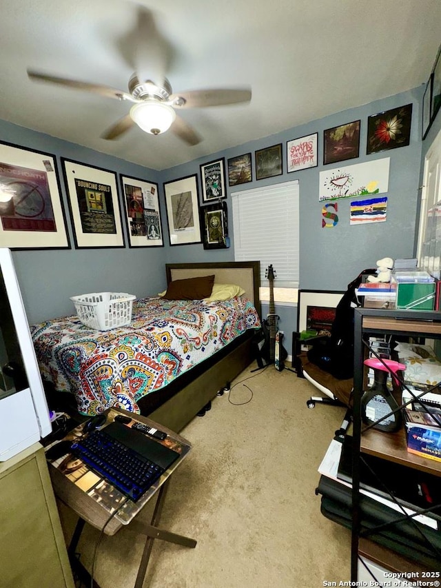 carpeted bedroom featuring a ceiling fan