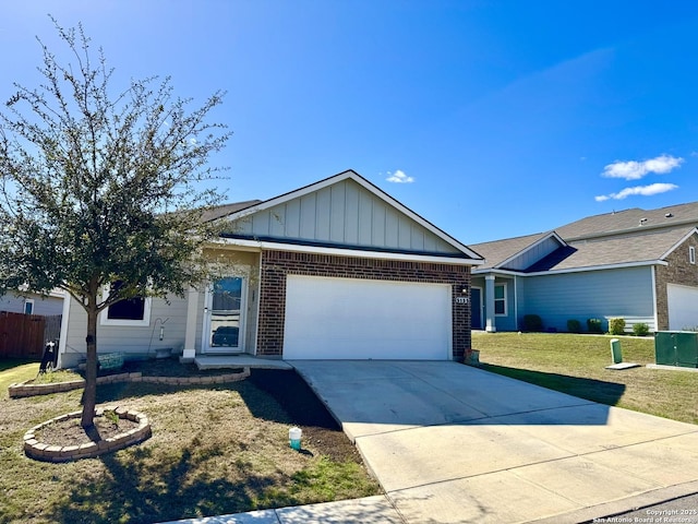 ranch-style home with a front yard, brick siding, concrete driveway, a garage, and board and batten siding