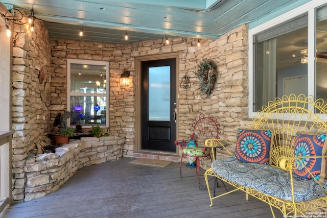 doorway to property with stone siding