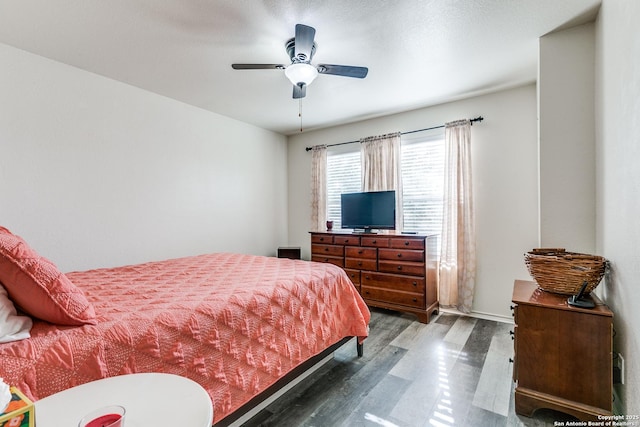 bedroom featuring wood finished floors and ceiling fan