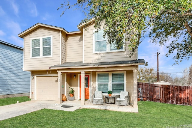 view of front of property with a garage, driveway, a front lawn, and fence