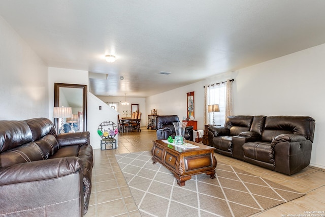 living area featuring light tile patterned floors and visible vents