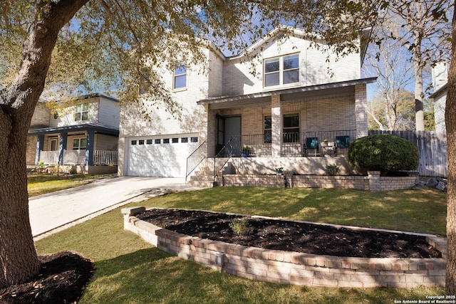 view of front of house with an attached garage, a front lawn, fence, covered porch, and driveway