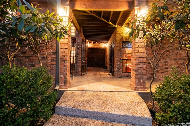entrance to property with brick siding