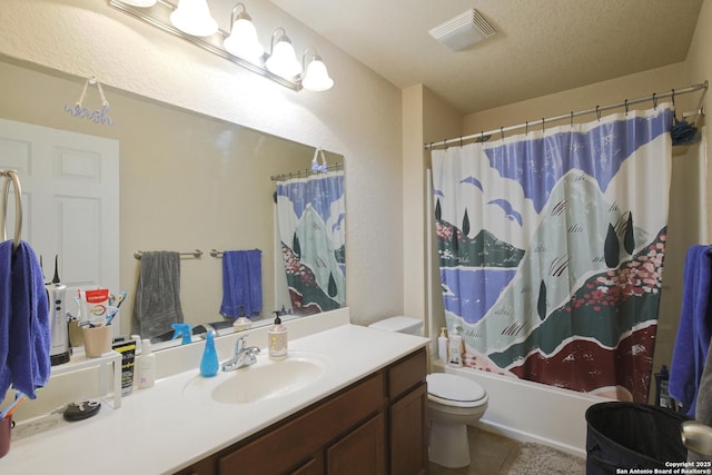 full bath featuring vanity, visible vents, shower / bath combination with curtain, a textured ceiling, and toilet