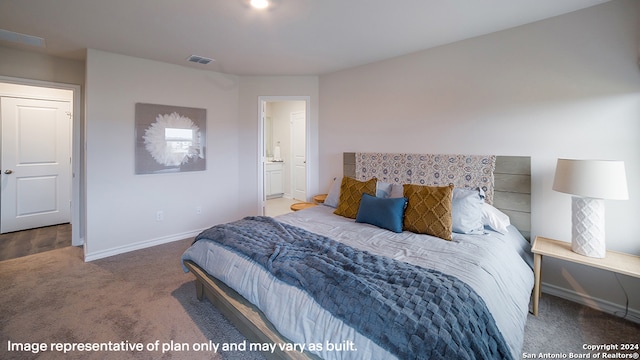 carpeted bedroom featuring visible vents, ensuite bath, and baseboards