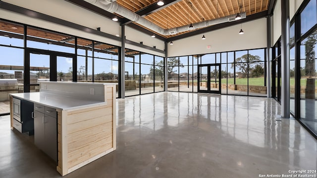 unfurnished sunroom featuring wood ceiling