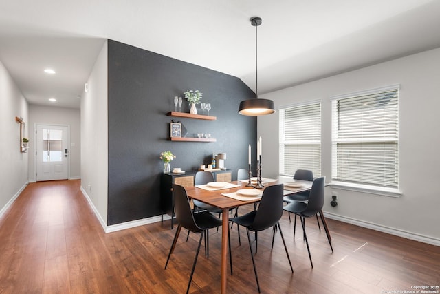 dining space with vaulted ceiling, recessed lighting, baseboards, and wood finished floors