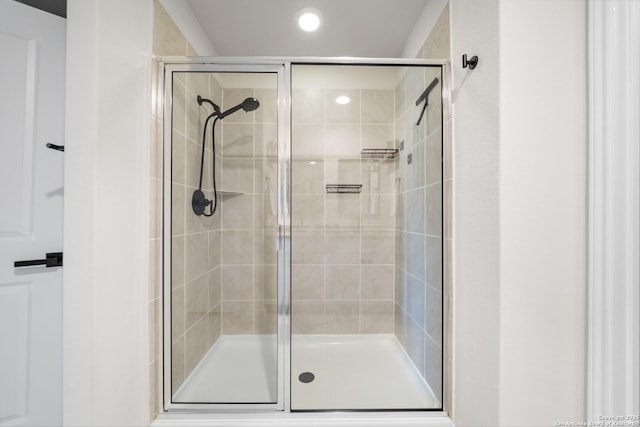 full bathroom featuring a shower stall