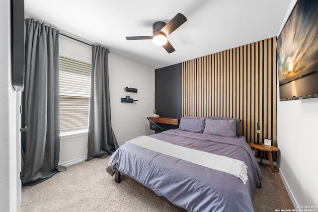 bedroom with carpet flooring, a ceiling fan, and baseboards