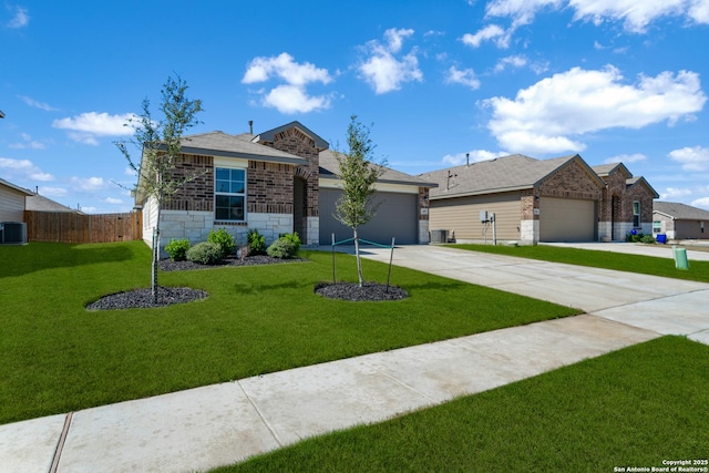 view of front of property featuring driveway, central AC, a front lawn, a garage, and stone siding