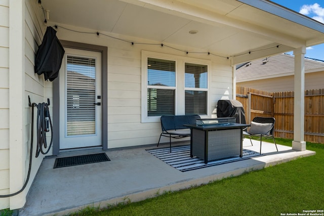 view of patio featuring grilling area and fence