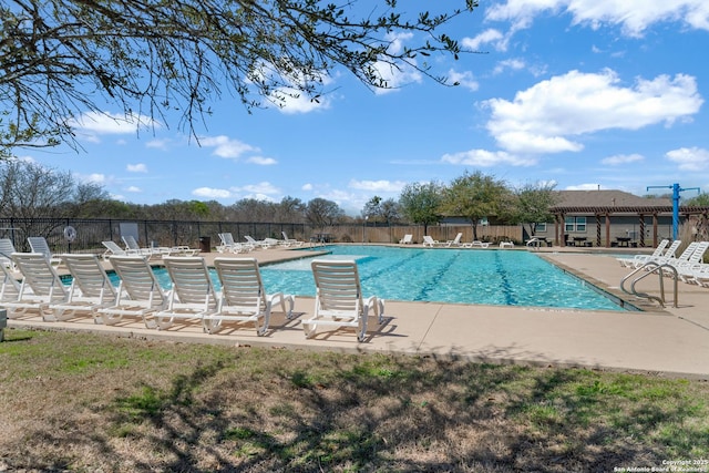 pool featuring a patio area and fence