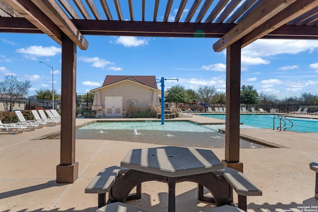 pool featuring fence, a pergola, and a patio area