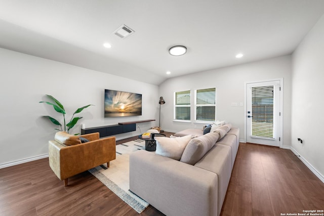 living area with visible vents, recessed lighting, and wood finished floors