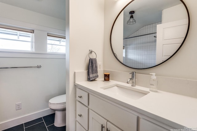 full bath featuring baseboards, toilet, vanity, and tile patterned flooring