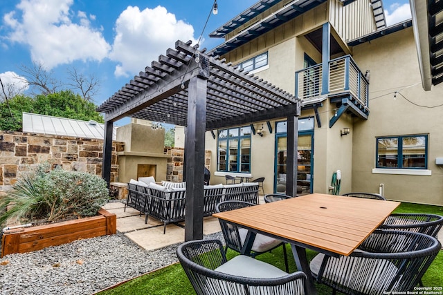 view of patio / terrace featuring outdoor dining space, an outdoor living space with a fireplace, and a pergola