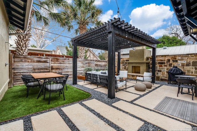 view of patio / terrace with outdoor dining area, fence, a pergola, and an outdoor hangout area