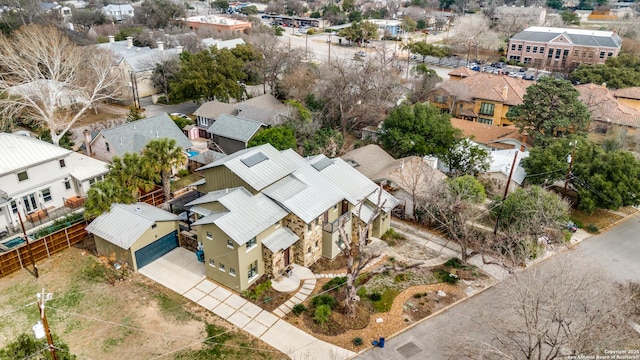 birds eye view of property with a residential view