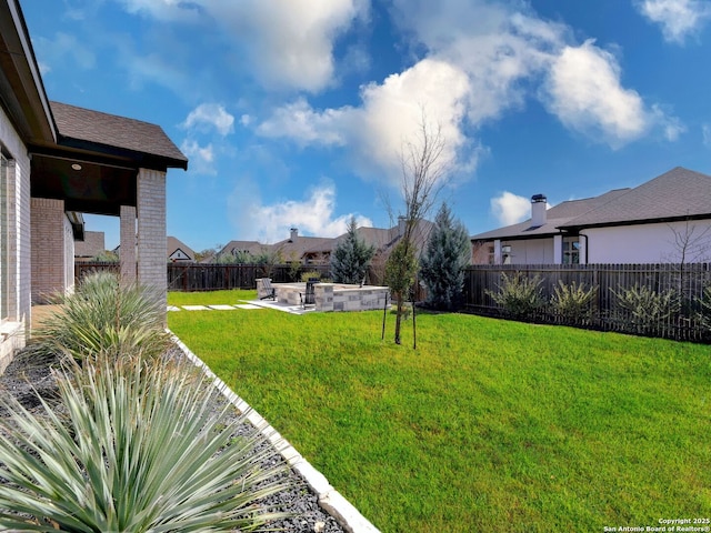 view of yard with a patio area and a fenced backyard