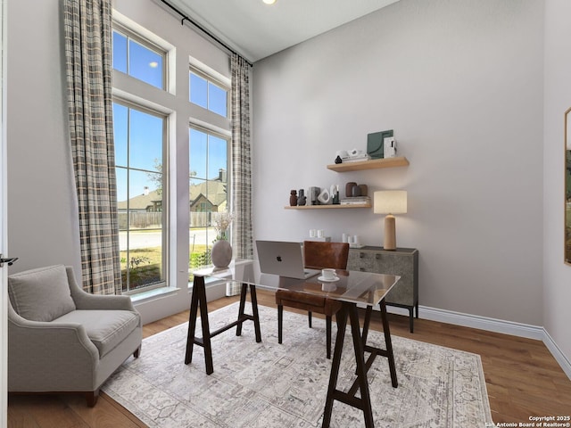 office with wood finished floors and baseboards