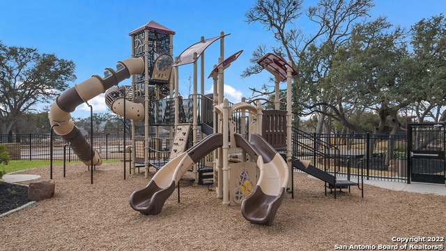 community jungle gym with fence