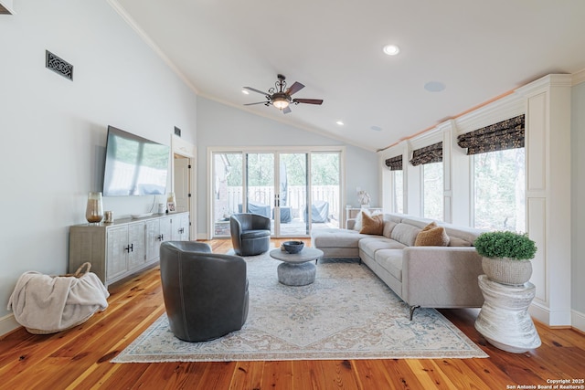 living room featuring recessed lighting, light wood-style flooring, a ceiling fan, and ornamental molding