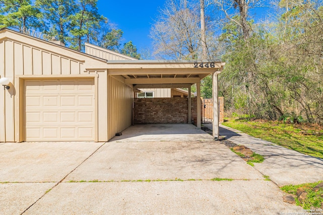 exterior space with a carport and concrete driveway