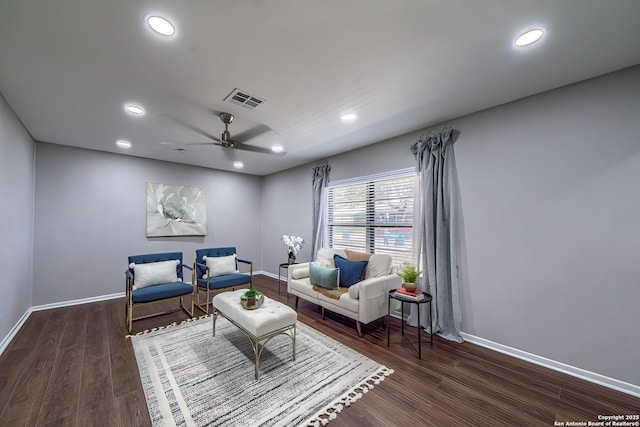 living area with recessed lighting, visible vents, and wood finished floors