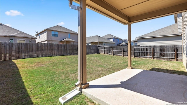 view of yard with a fenced backyard and a patio area