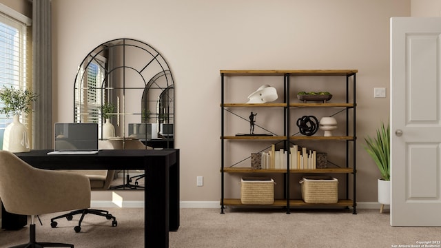 carpeted home office featuring baseboards