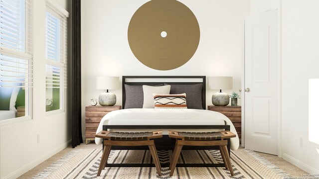 bedroom with baseboards and light colored carpet