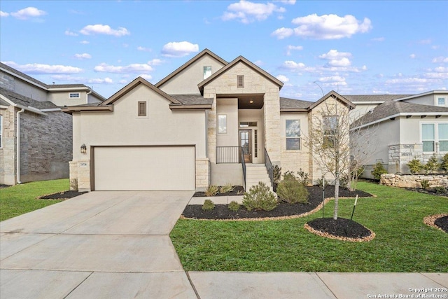 view of front of property with a garage, stucco siding, driveway, and a front yard