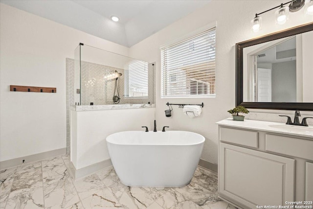 full bath with walk in shower, baseboards, a freestanding bath, and marble finish floor