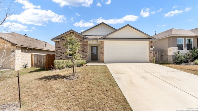 single story home with an attached garage, fence, brick siding, and driveway