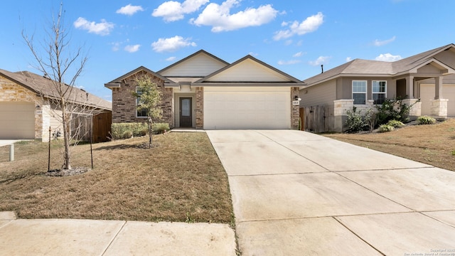 ranch-style home featuring brick siding, concrete driveway, an attached garage, and fence