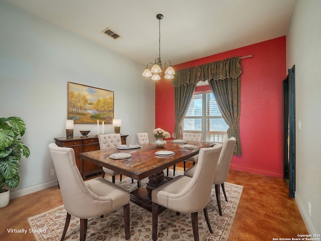 dining room featuring a notable chandelier, baseboards, and visible vents