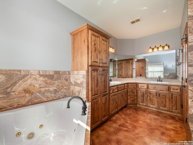 full bathroom with visible vents, a jetted tub, finished concrete floors, and a sink