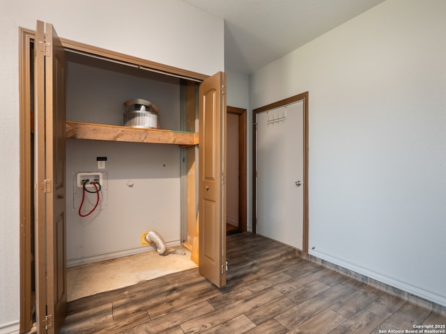 washroom featuring dark wood-type flooring, washer hookup, and laundry area