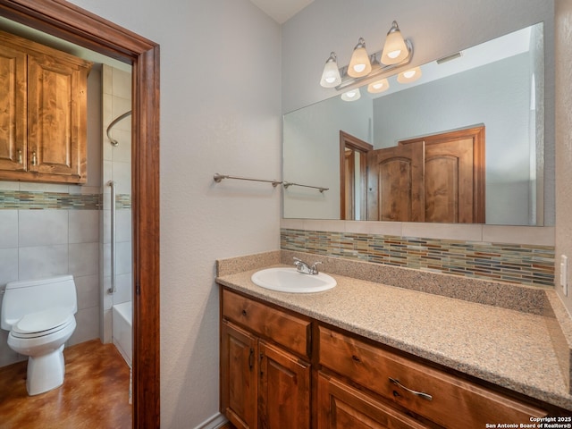 bathroom featuring decorative backsplash, toilet, vanity, and visible vents