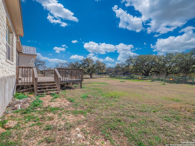 view of yard with a wooden deck