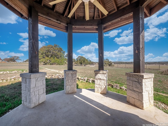 view of patio / terrace with a gazebo and a rural view