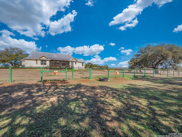 view of yard featuring a vegetable garden and fence