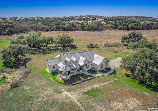 birds eye view of property featuring a rural view