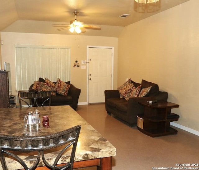 living area with lofted ceiling, baseboards, visible vents, and ceiling fan