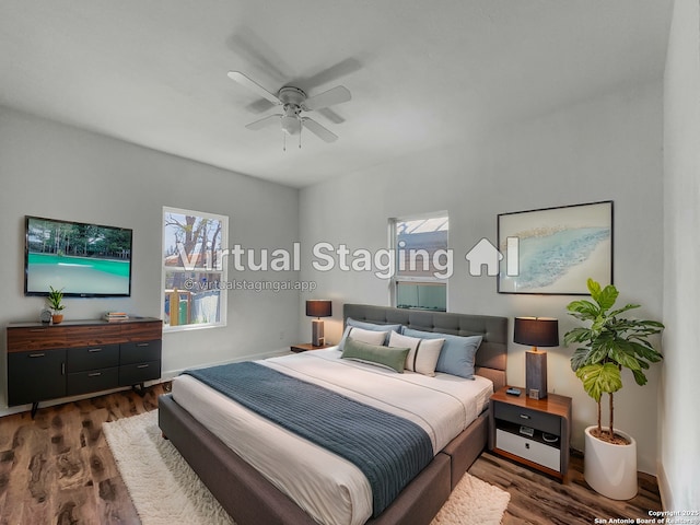 bedroom with baseboards, a ceiling fan, and wood finished floors