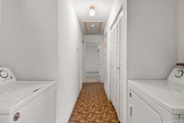 clothes washing area with attic access, independent washer and dryer, and laundry area