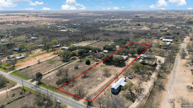 birds eye view of property featuring a rural view