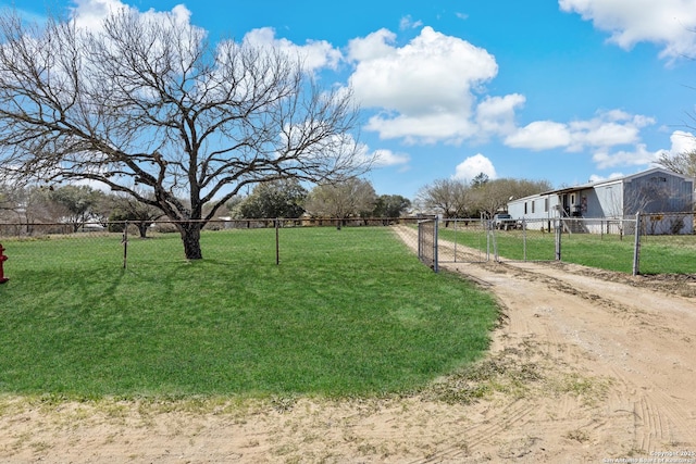 exterior space featuring a yard and fence